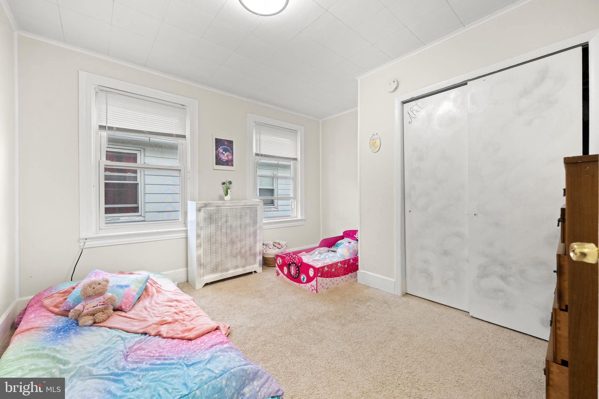 1009 Queen Street Pottstown, PA 19464 - Photo 16 of 17 a bedroom with a bed and a window