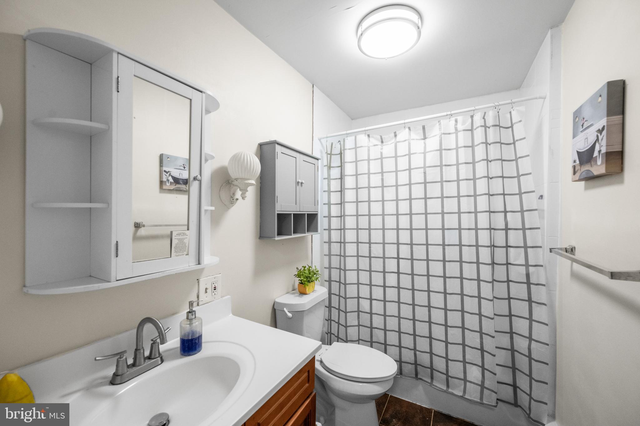 1009 Queen Street Pottstown, PA 19464 - Photo 17 of 17 a bathroom with a sink toilet and shower