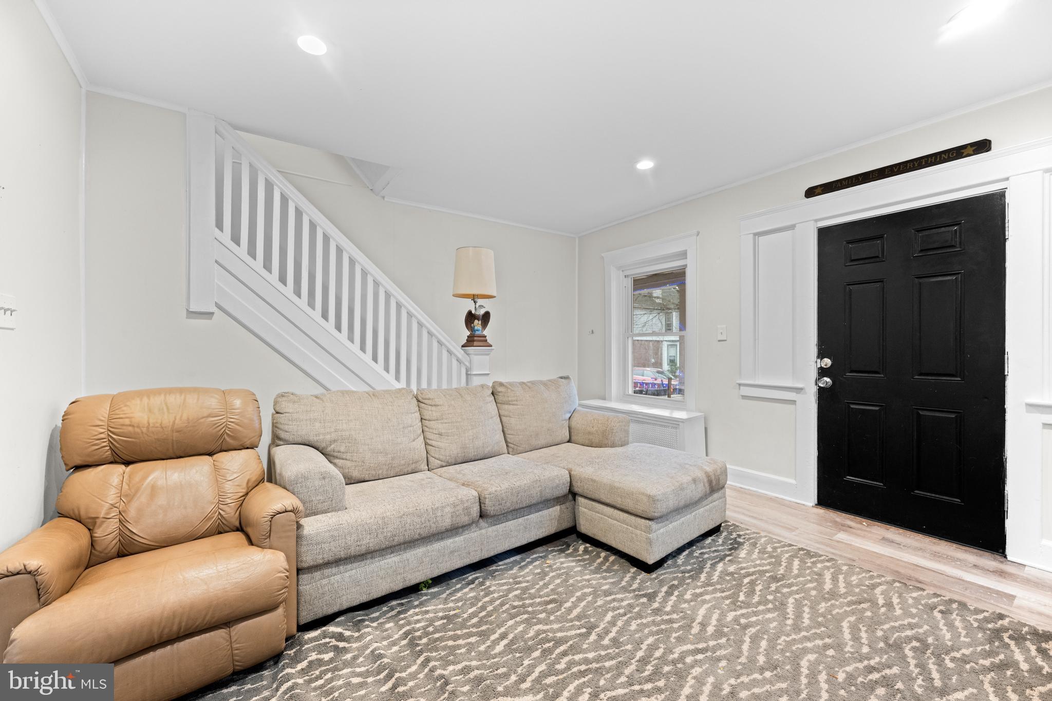 1009 Queen Street Pottstown, PA 19464 - Photo 3 of 17 a living room with furniture and a rug