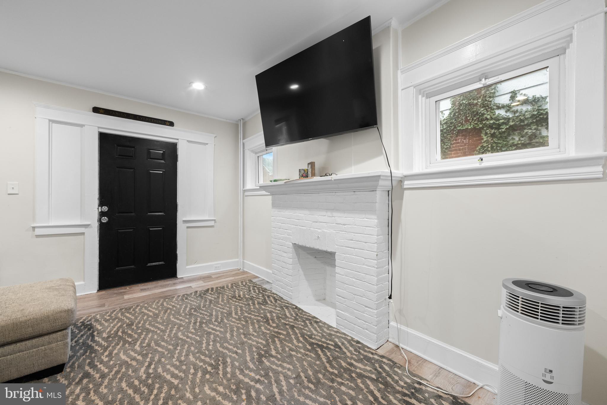 1009 Queen Street Pottstown, PA 19464 - Photo 5 of 17 a view of a livingroom with a flat screen tv
