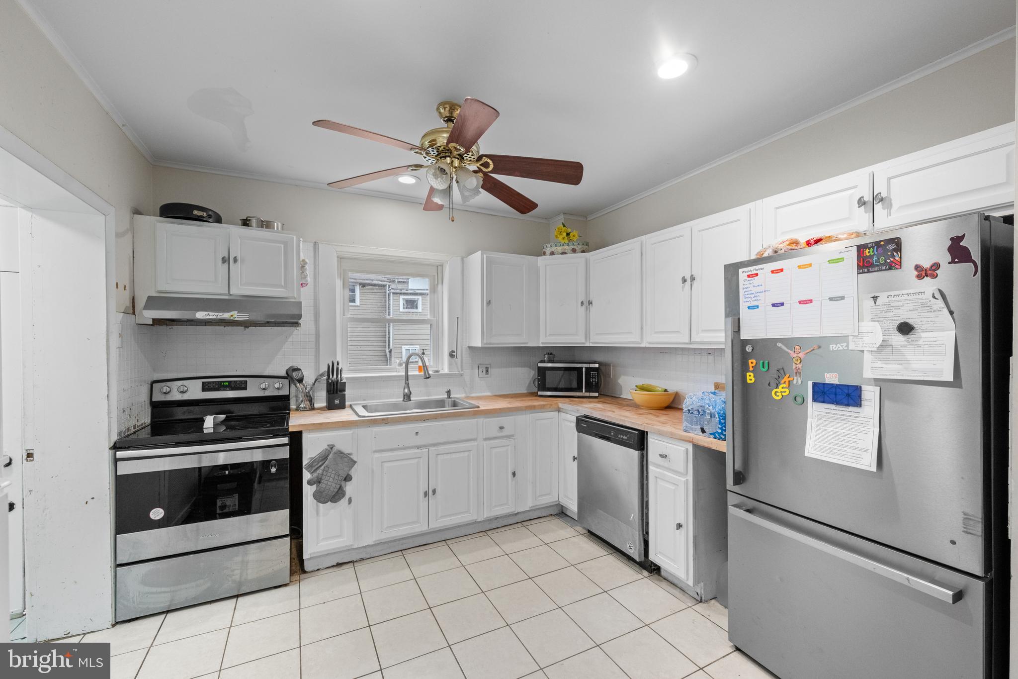 1009 Queen Street Pottstown, PA 19464 - Photo 10 of 17 a kitchen with cabinets stainless steel appliances and a counter space
