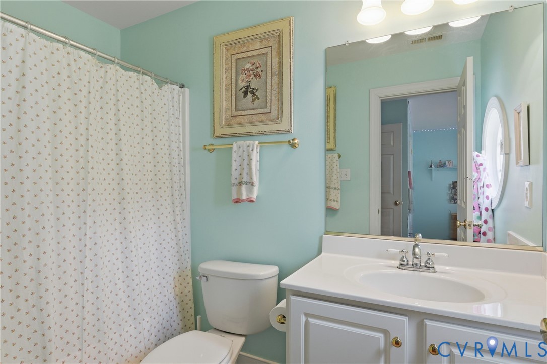 13424 Tipple Point Road Midlothian, VA 23114 - Photo 36 of 53 a bathroom with a sink and a mirror