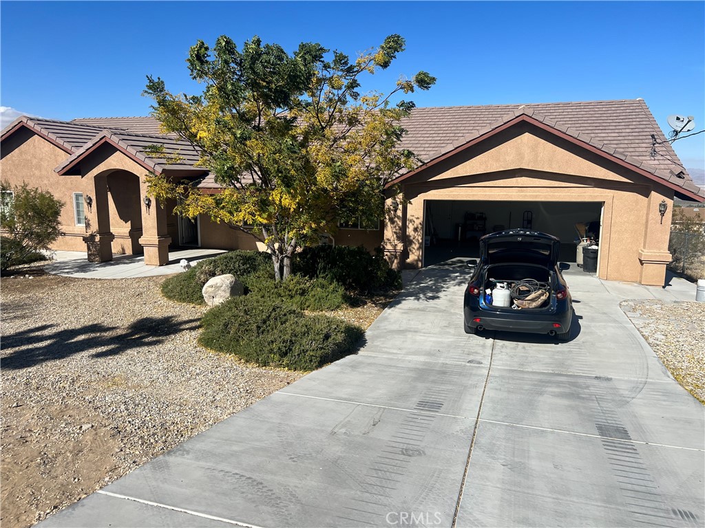 32636 Sapphire Road Lucerne Valley, CA 92356 - Photo 2 of 19 a car parked in front of house