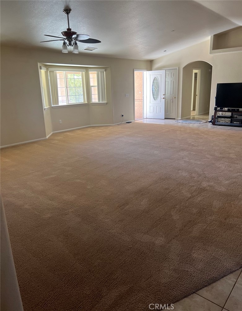 32636 Sapphire Road Lucerne Valley, CA 92356 - Photo 5 of 19 a view of a livingroom with a chandelier fan and windows