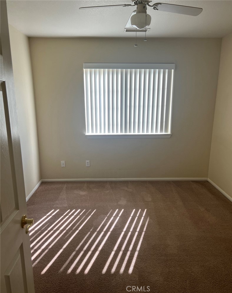 32636 Sapphire Road Lucerne Valley, CA 92356 - Photo 7 of 19 a view of wooden floor and chair in a room