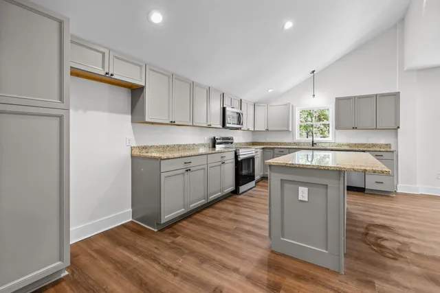 a view of an empty room with a fireplace