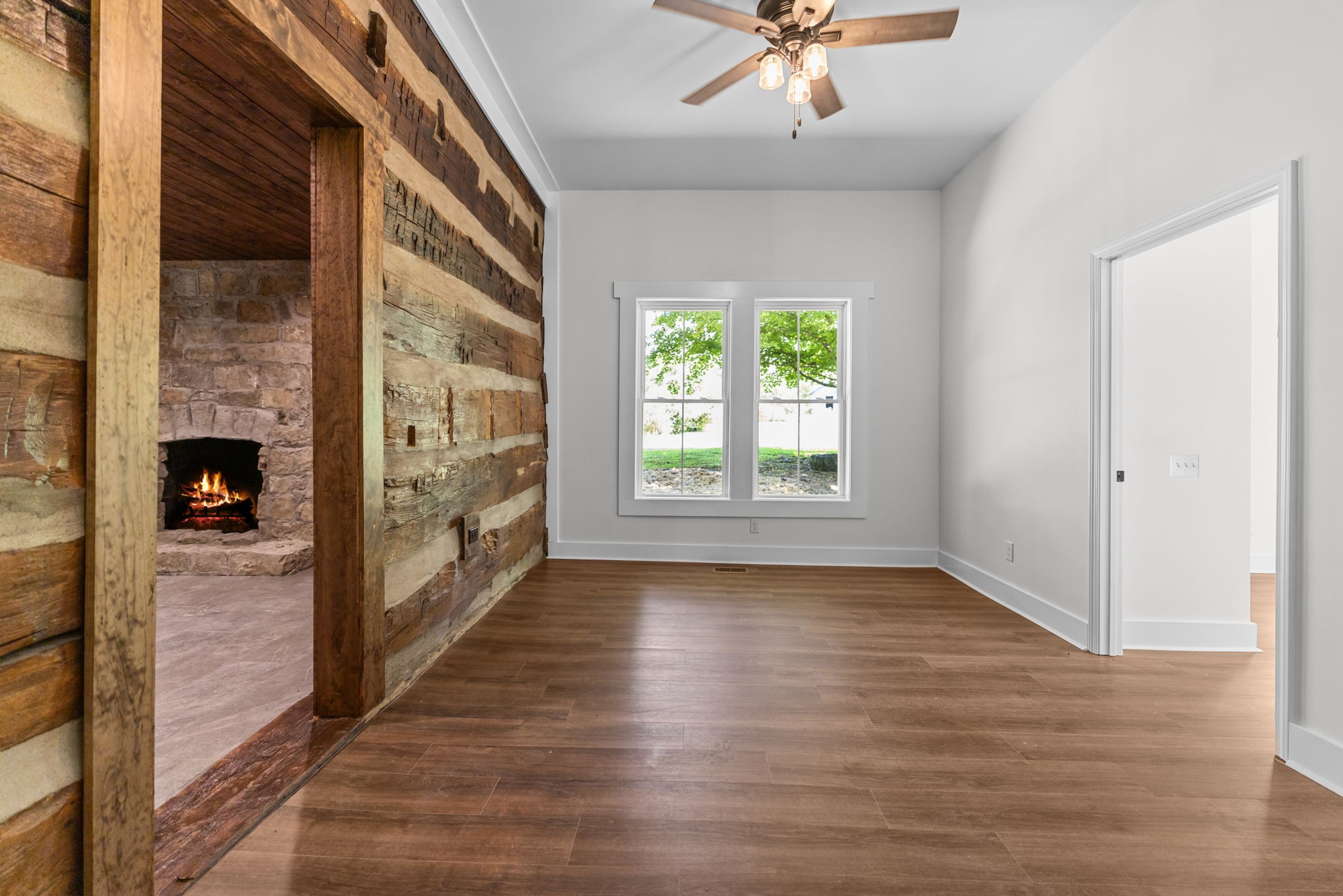 1881 New Herman Road Fayetteville, TN 37334 - Photo 22 of 58 wooden floor in an empty room with a window