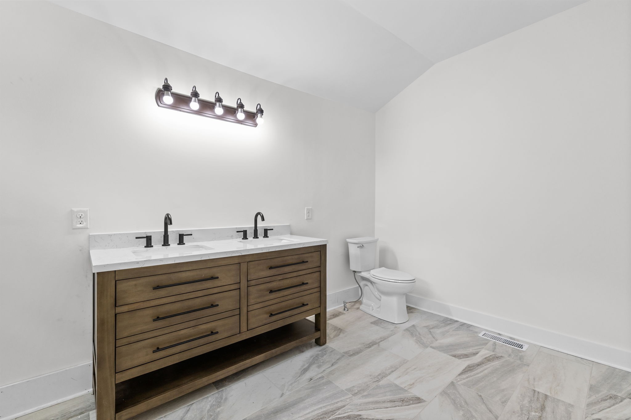 1881 New Herman Road Fayetteville, TN 37334 - Photo 29 of 58 a bathroom with a toilet a sink and mirror