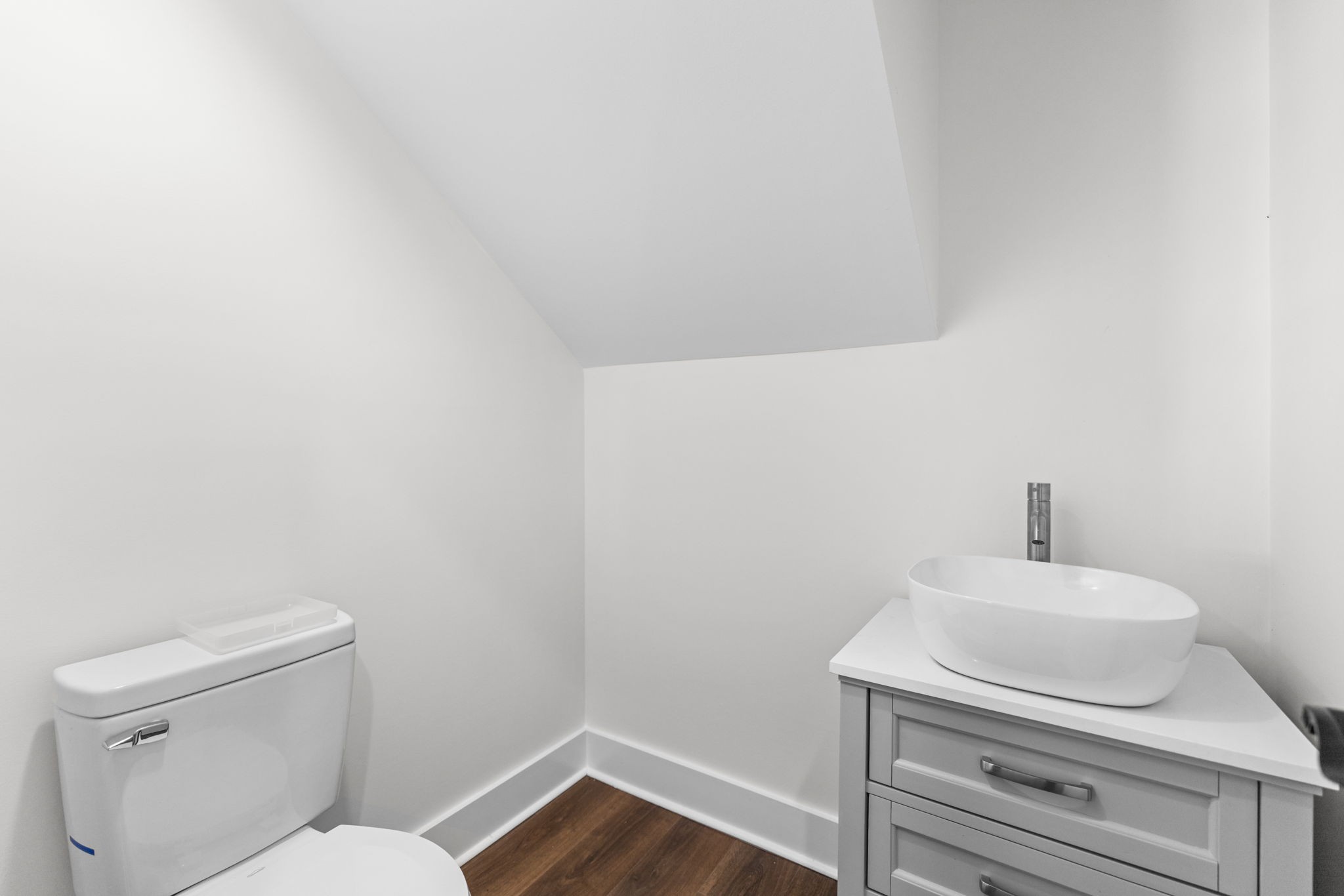 1881 New Herman Road Fayetteville, TN 37334 - Photo 35 of 58 a bathroom with a toilet a sink and wooden floor