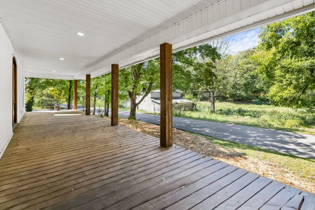 a view of front door with wooden floor