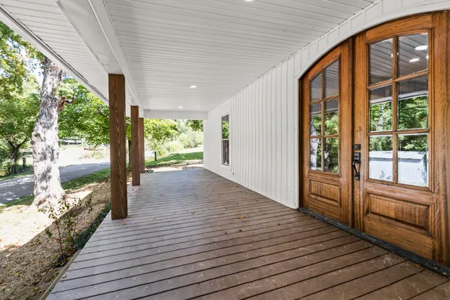 a view of hallway with wooden floor