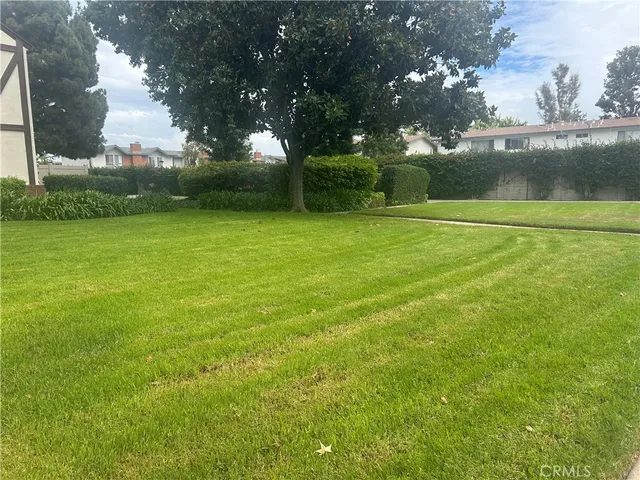 a building outdoor space with patio furniture and potted plants