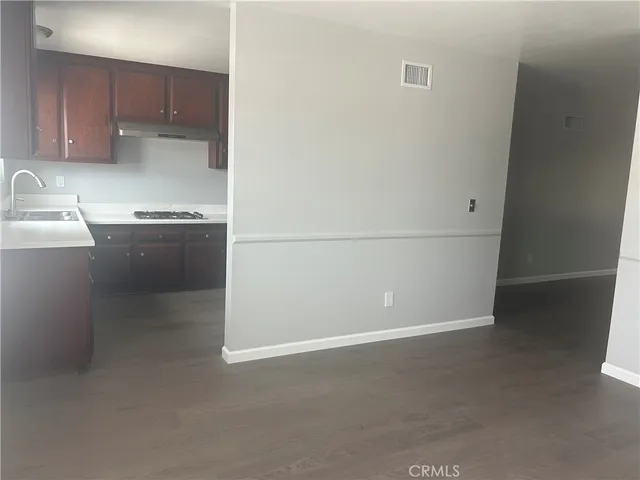 a kitchen with a sink and a refrigerator