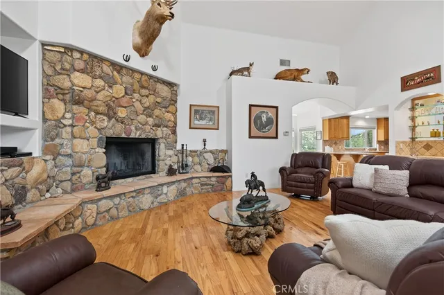 a kitchen with granite countertop a sink window and cabinets