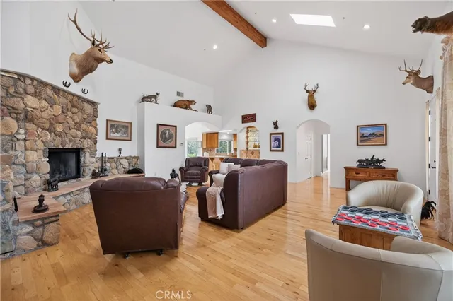 a large kitchen with stainless steel appliances granite countertop a sink and cabinets