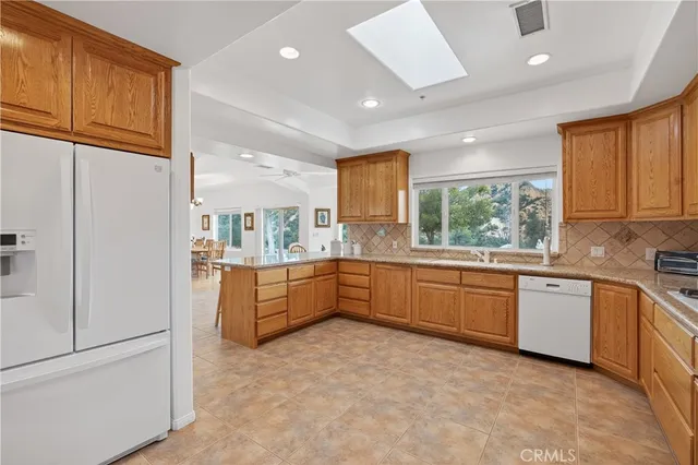 a dining room with furniture window and wooden floor