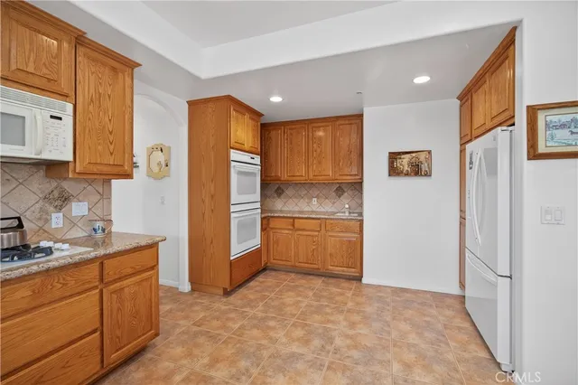 a view of a balcony with furniture and window