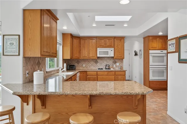 a bedroom with a large bed and a tv