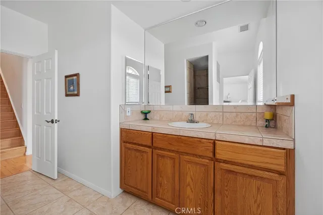 a living room with stainless steel appliances kitchen island granite countertop furniture and a kitchen view