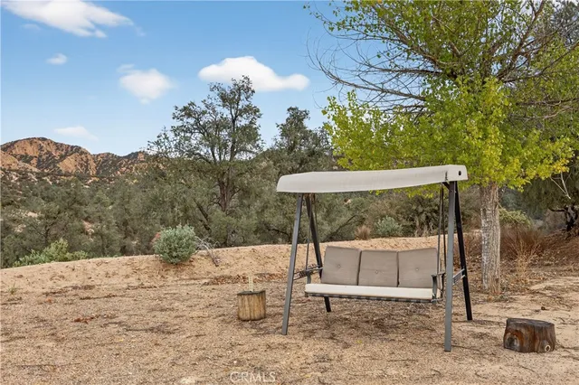an aerial view of a houses with a yard