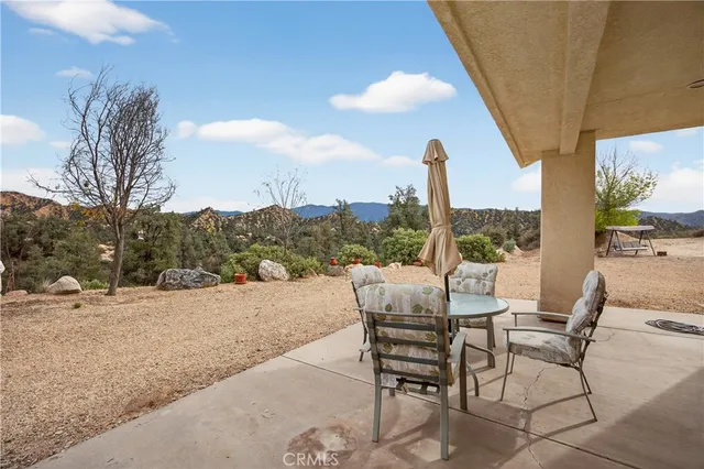 a view of a house with a mountain in the background