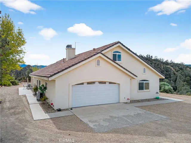 a view of a field with a mountain in the background