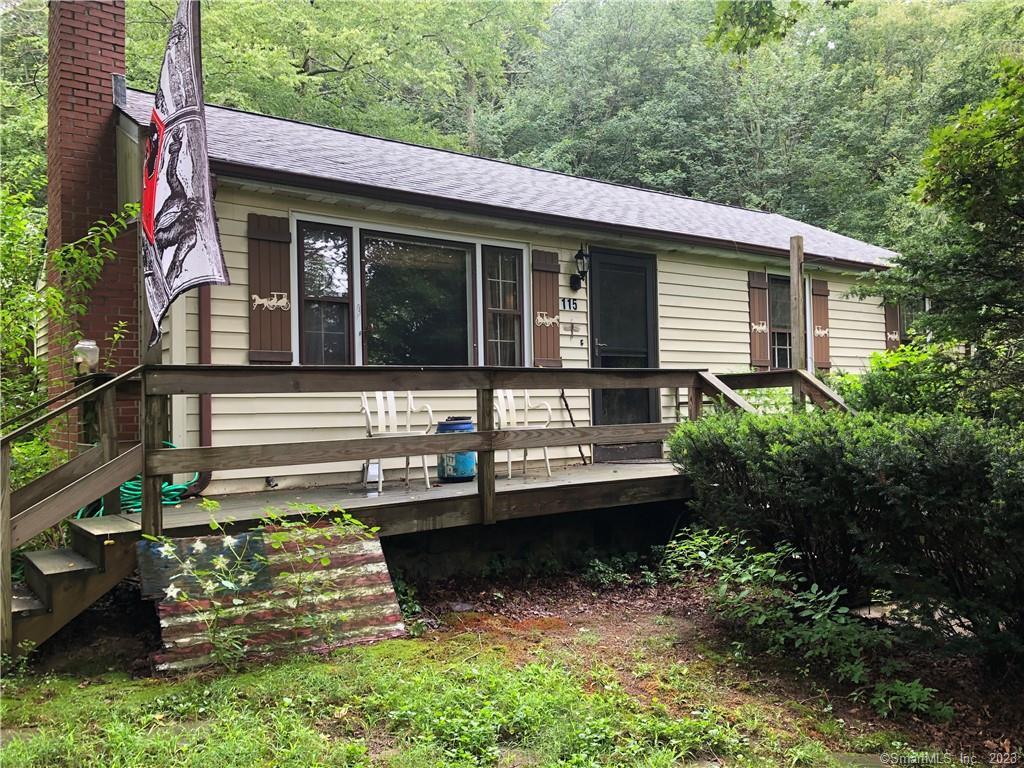 a view of house with backyard