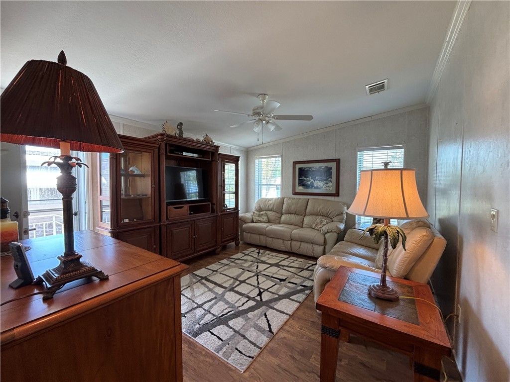 6171 98th Road Sebastian, FL 32958 - Photo 8 of 14 a living room with furniture and a flat screen tv