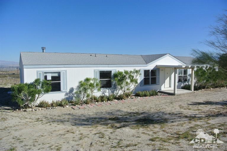 15488 Desert View Road Whitewater, CA 92282 - Photo 1 of 19 a front view of a house with garden