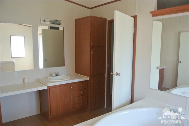 15488 Desert View Road Whitewater, CA 92282 - Photo 11 of 19 a bathroom with a sink and a mirror