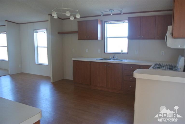 15488 Desert View Road Whitewater, CA 92282 - Photo 13 of 19 a kitchen with wooden floors and sink