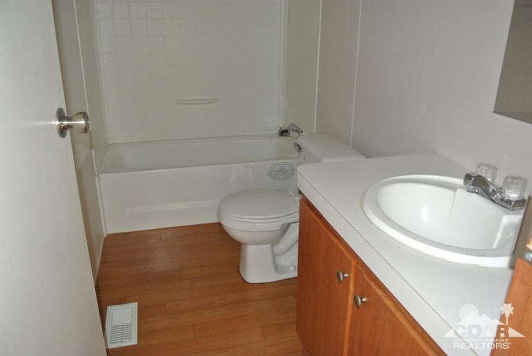 15488 Desert View Road Whitewater, CA 92282 - Photo 19 of 19 a bathroom with a sink a toilet and shower