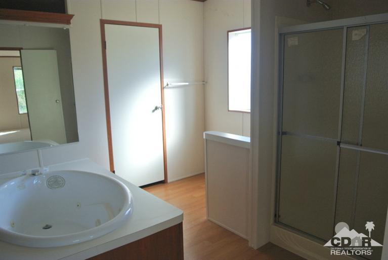 15488 Desert View Road Whitewater, CA 92282 - Photo 9 of 19 a bathroom with a sink and a large mirror