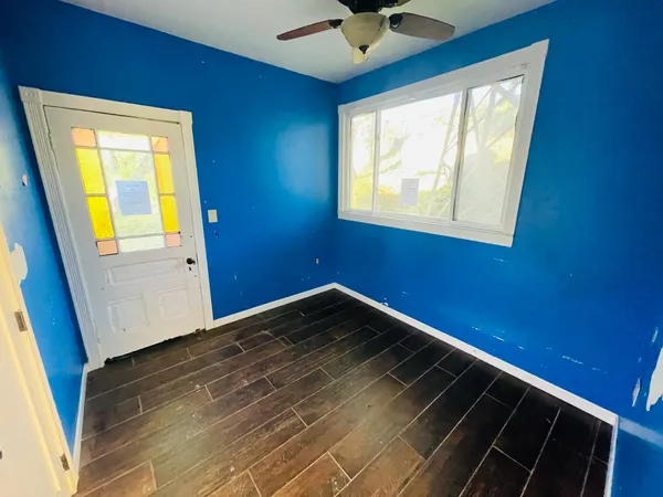 a view of an empty room with a window