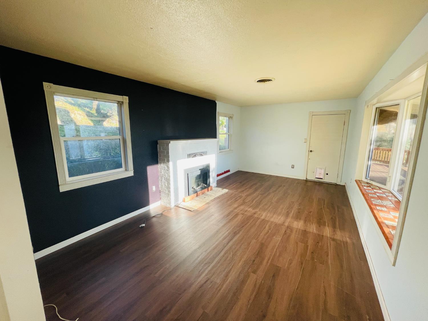 210 South Summit Street Ione, CA 95640 - Photo 26 of 27 wooden floor in an empty room with a window