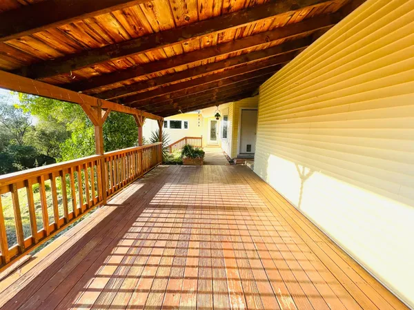 a view of balcony with wooden floor