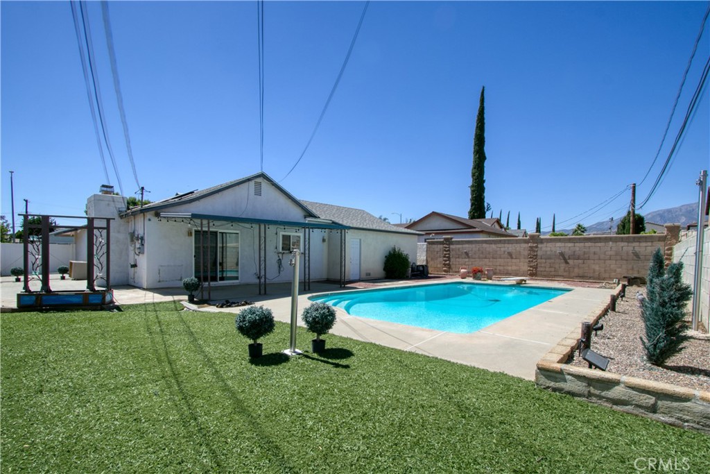 1034 Thompson Avenue Banning, CA 92220 - Photo 1 of 24 a front view of a house with garden