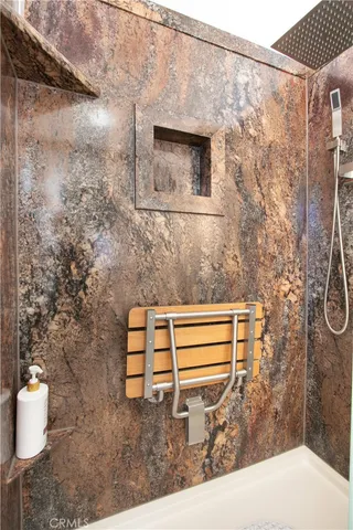 a bathroom with a shower and a sink
