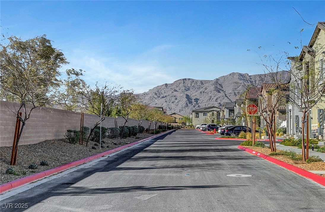 7204 North Decatur Boulevard North Las Vegas, NV 89084 - Photo 55 of 55 View of street with a mountain view, a residential view, and curbs