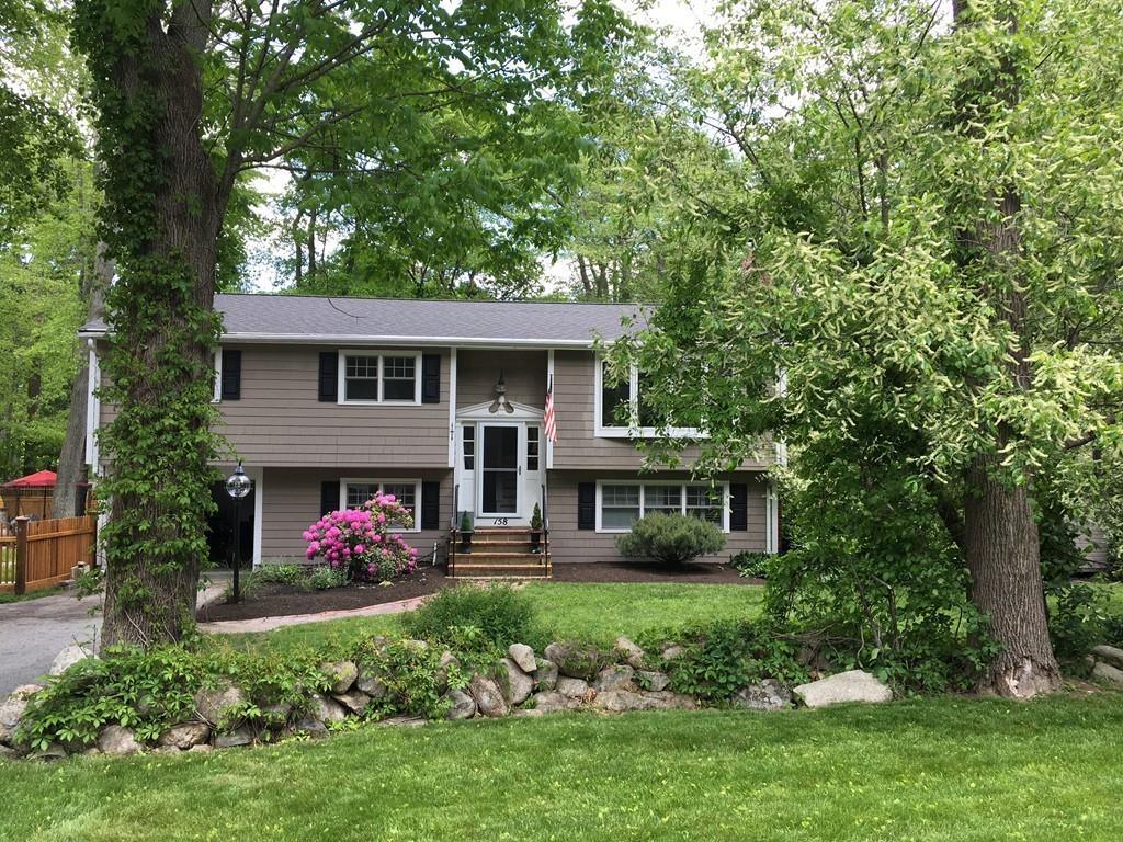 158 Tilden Road Scituate, MA 02066 - Photo 1 of 33 a front view of a house with garden