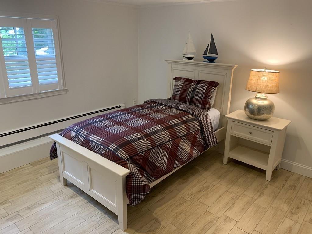 158 Tilden Road Scituate, MA 02066 - Photo 13 of 33 a bedroom with bed and a window