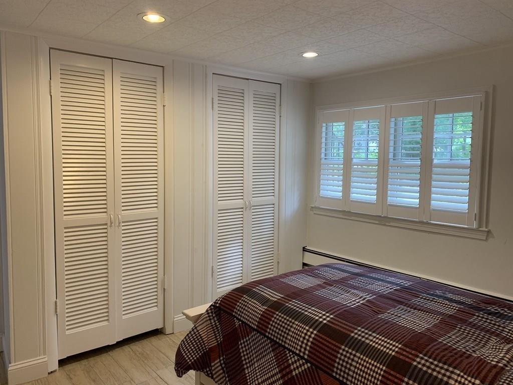 158 Tilden Road Scituate, MA 02066 - Photo 15 of 33 a bedroom with a bed and a window