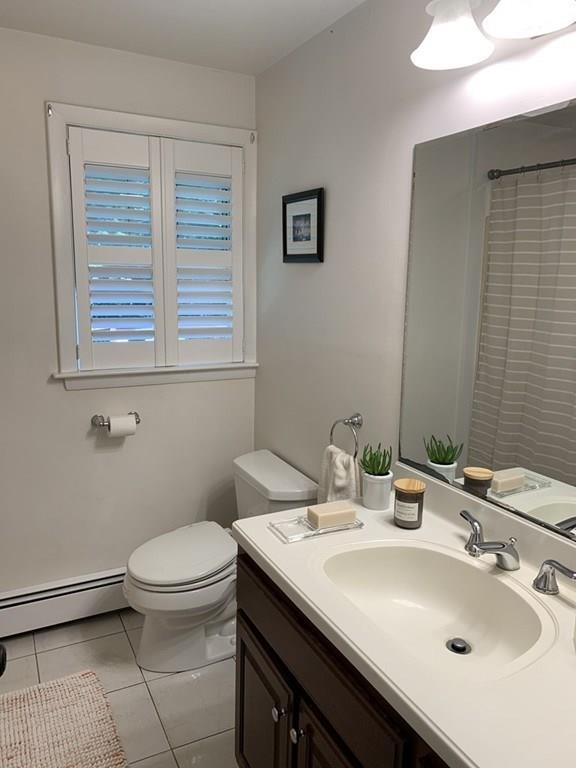 158 Tilden Road Scituate, MA 02066 - Photo 25 of 33 a bathroom with a sink a toilet and a mirror