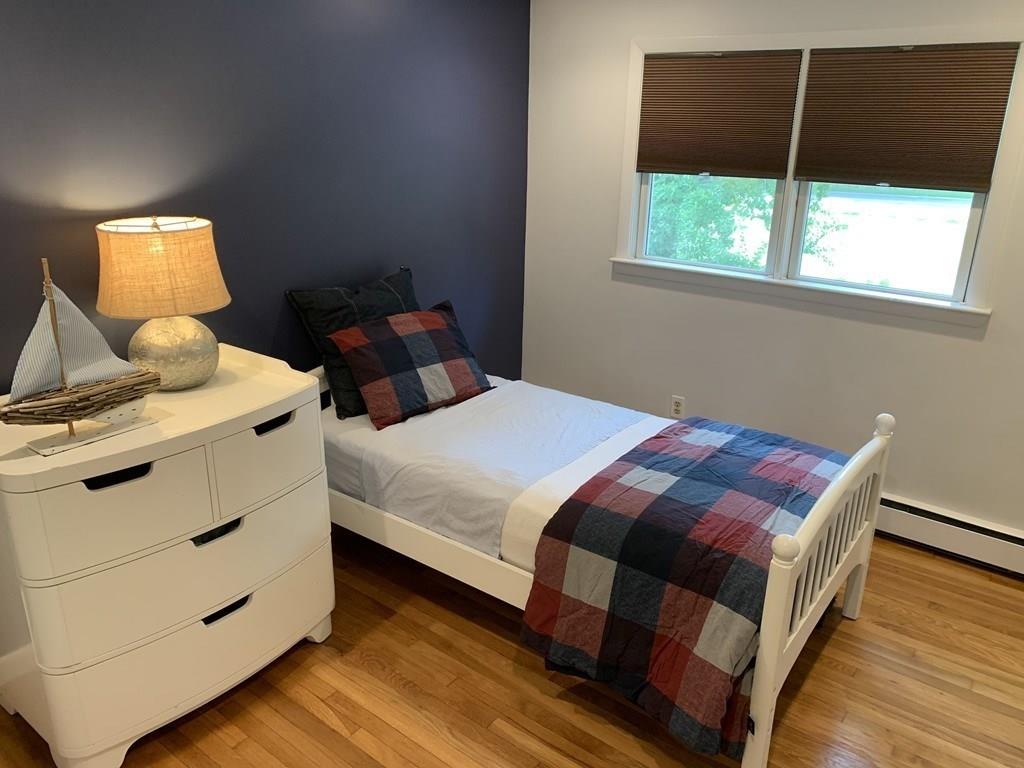 158 Tilden Road Scituate, MA 02066 - Photo 6 of 33 a bedroom with a bed and window