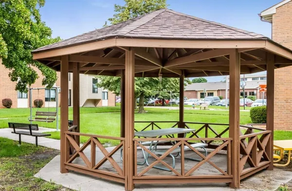 a view of chairs and table in the patio