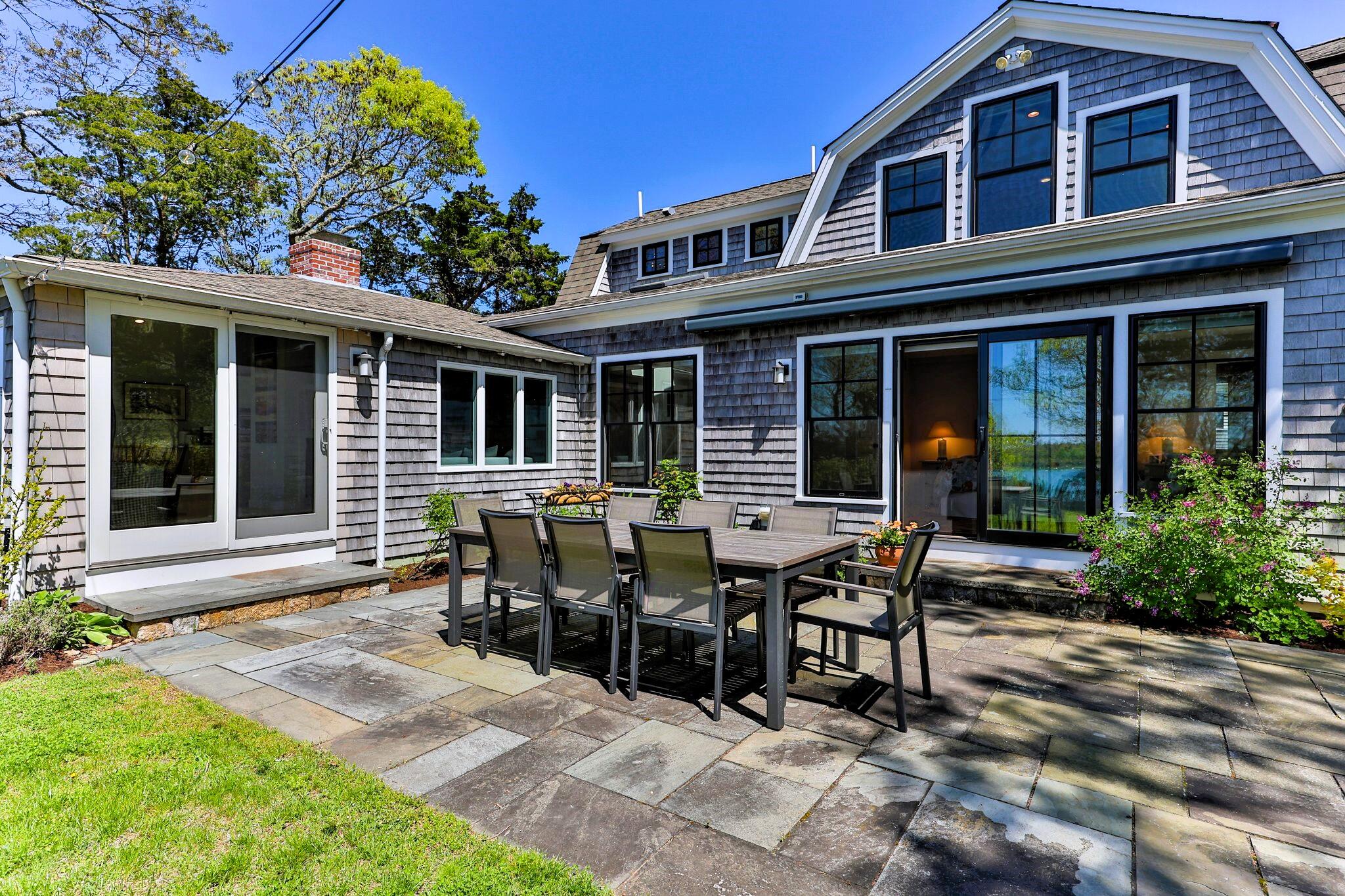40 Gibson Road Orleans, MA 02653 - Photo 60 of 69 a view of a house with sitting area and garden