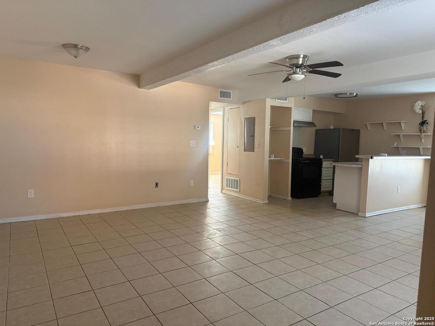 3718 Pleasanton Road, Unit 2104 San Antonio, TX 78221 - Photo 2 of 6 a view of an empty room and kitchen
