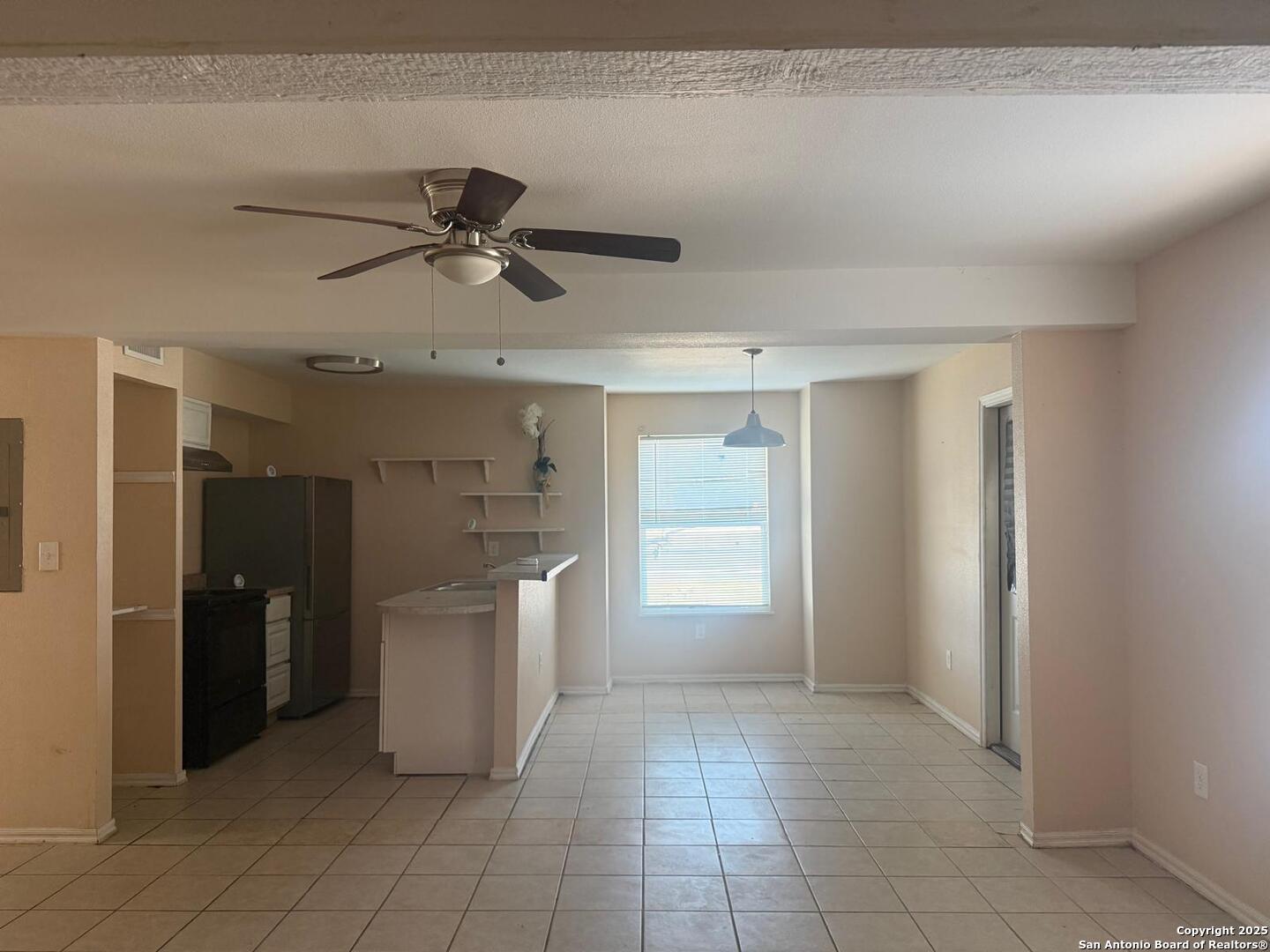 3718 Pleasanton Road, Unit 2104 San Antonio, TX 78221 - Photo 3 of 6 a view of a kitchen with a sink and a refrigerator