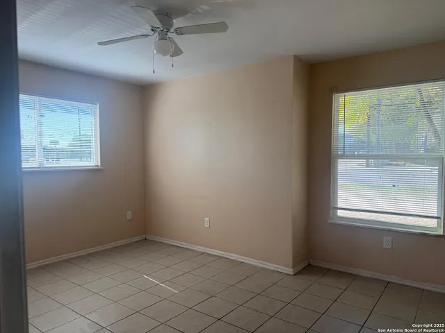 an empty room with windows