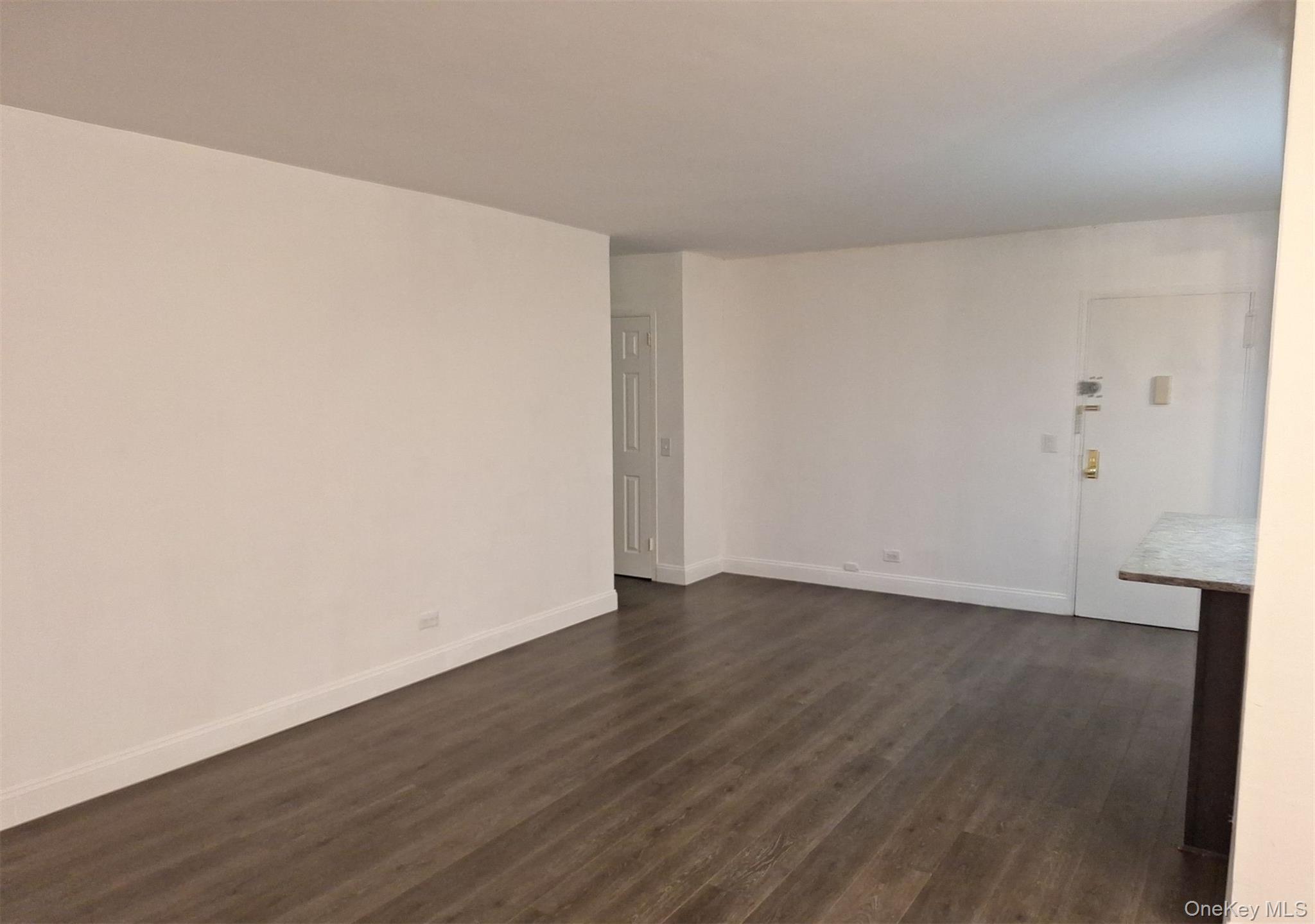 825 Morrison Avenue, Unit 12F Bronx, NY 10473 - Photo 10 of 15 a view of an empty room with wooden floor